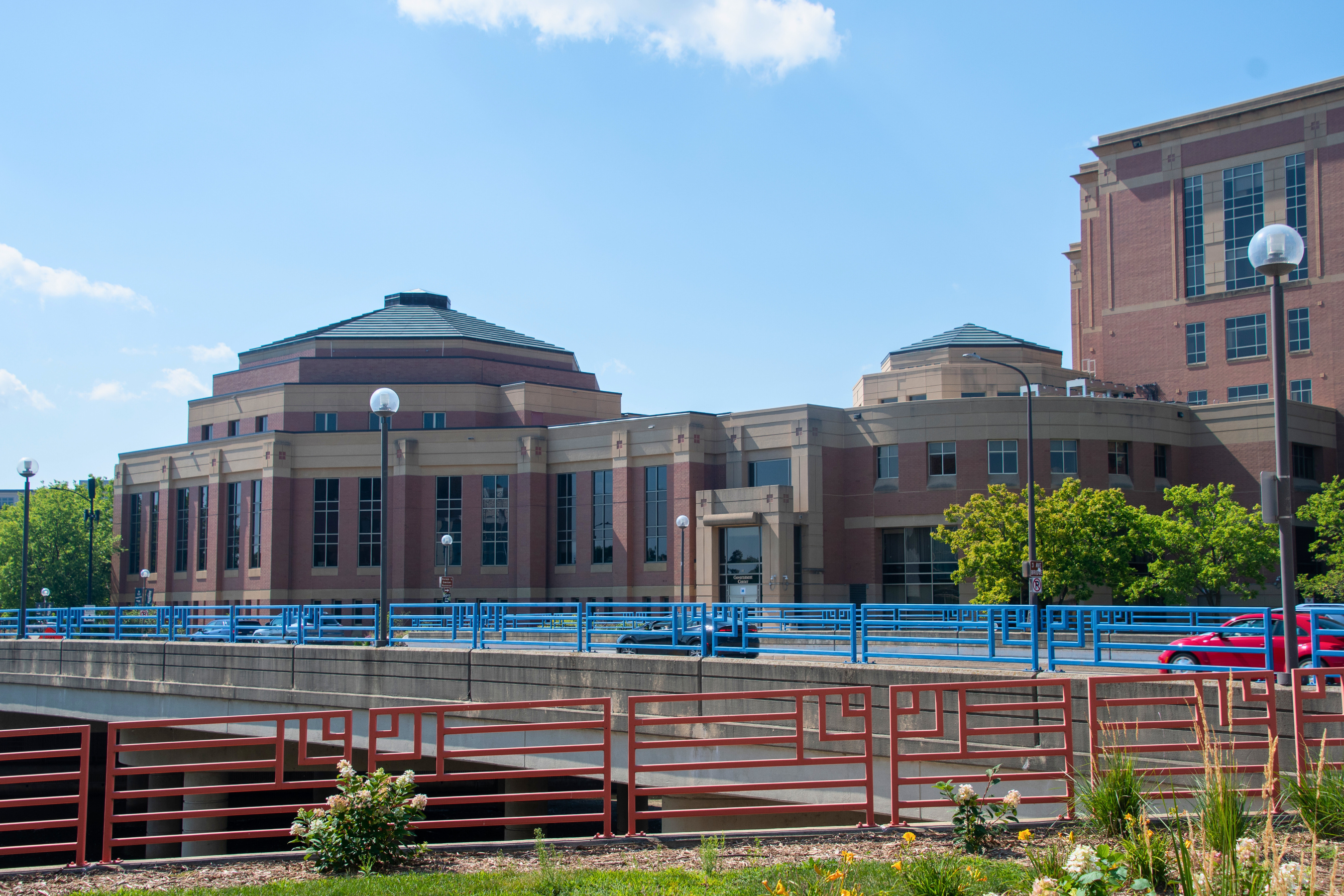 exterior of the City Hall side of the government center on a blue-skied day