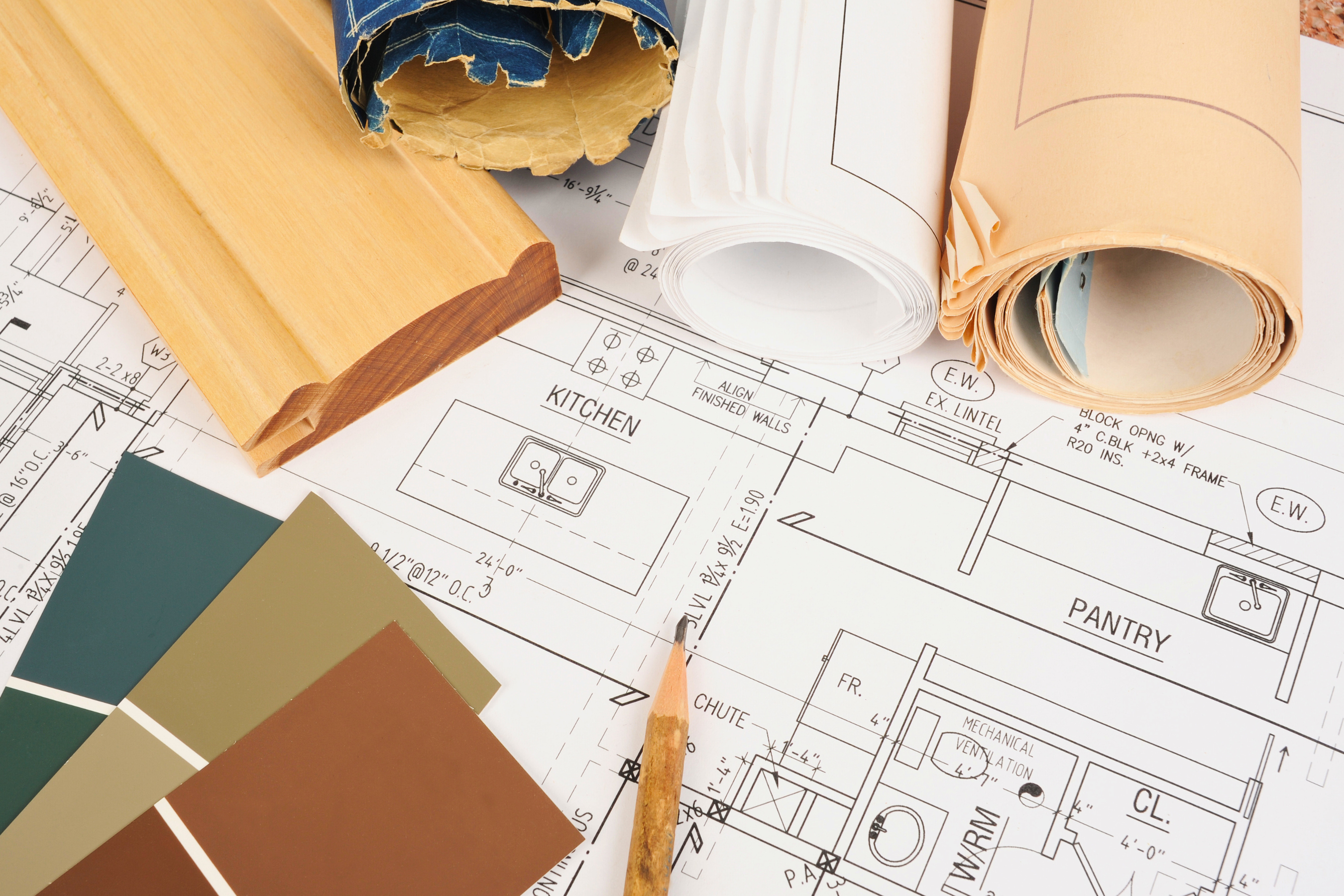 a set of home design plans with color swatches, trim samples and other plans on top of it.